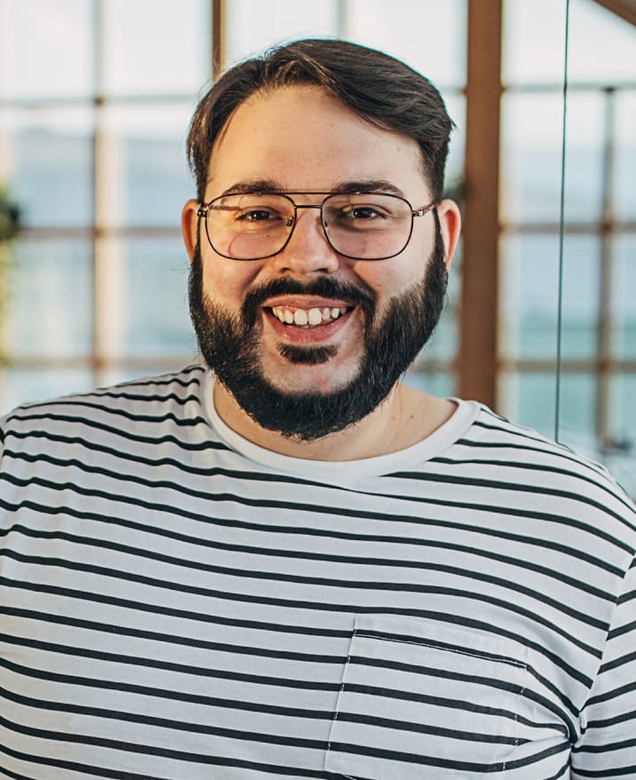 Close up of man smiling.